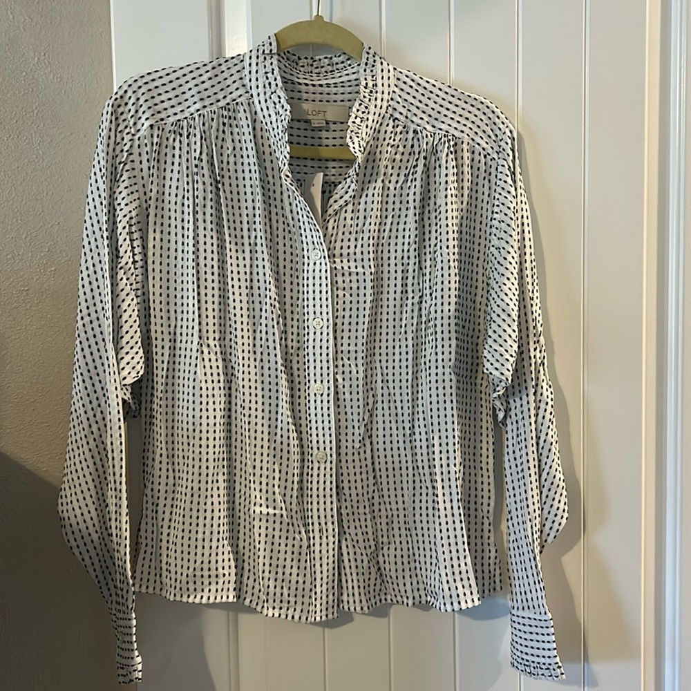 LOFT white blouse with black stripes and ruffle detail.
